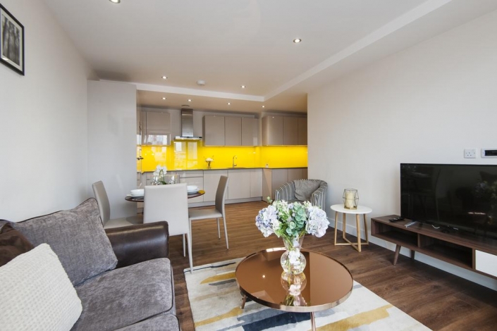 Cozy double bedroom with plush bedding and modern decor